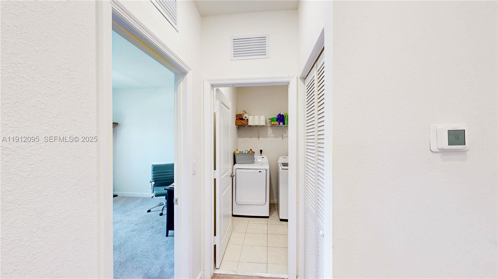11964 Southwest 244th Street Homestead, FL 33032 - Photo 21 of 62 a view of a bathroom from a hallway