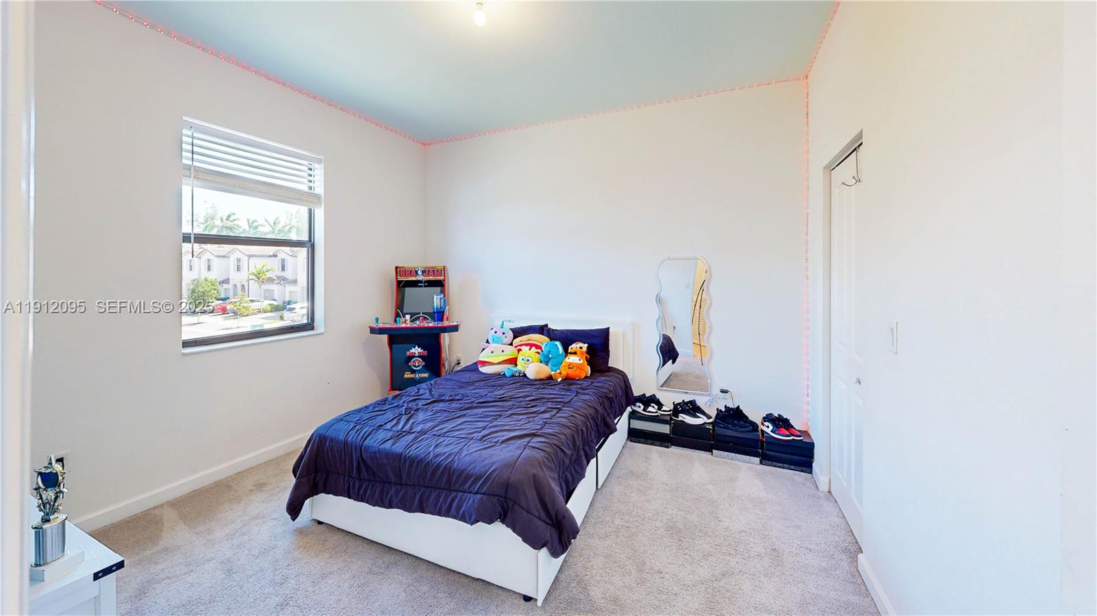 11964 Southwest 244th Street Homestead, FL 33032 - Photo 25 of 62 a bed room with a bed and a window