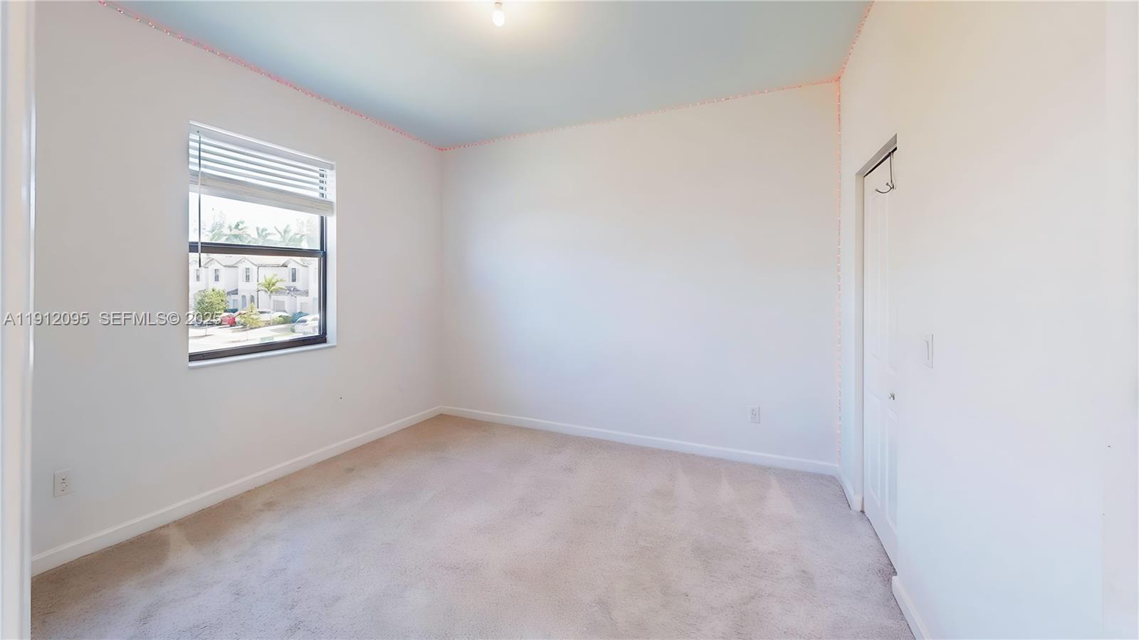 11964 Southwest 244th Street Homestead, FL 33032 - Photo 26 of 62 an empty room with windows