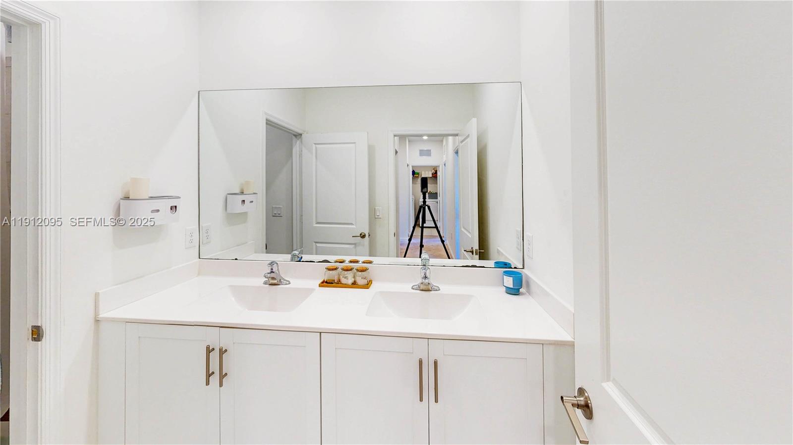 11964 Southwest 244th Street Homestead, FL 33032 - Photo 28 of 62 a bathroom with a sink and a mirror