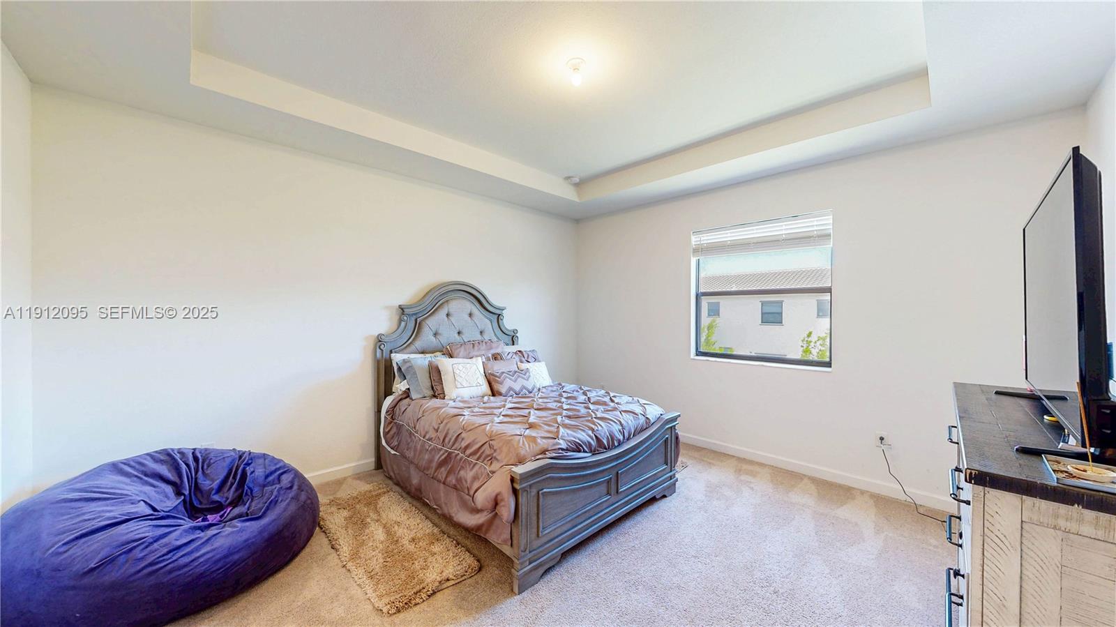 11964 Southwest 244th Street Homestead, FL 33032 - Photo 30 of 62 a living room with furniture a couch and a flat screen tv