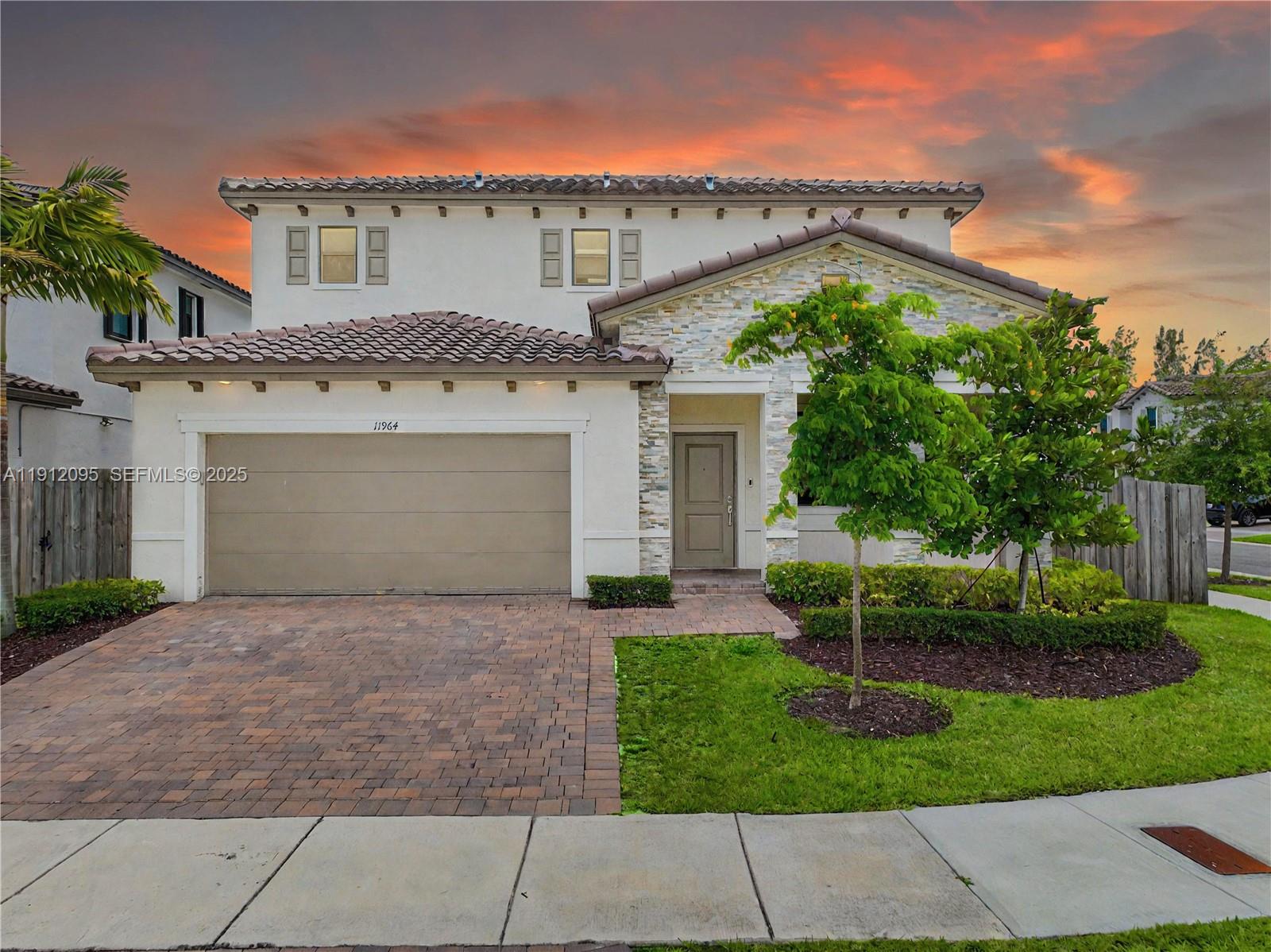 11964 Southwest 244th Street Homestead, FL 33032 - Photo 3 of 62 front view of house with a yard