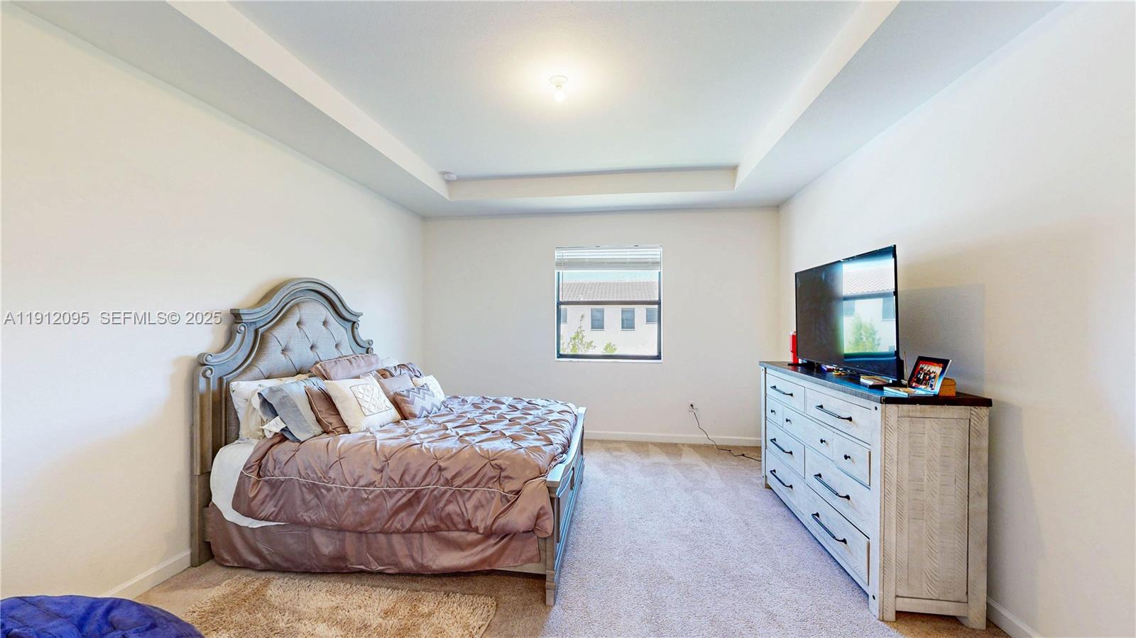 11964 Southwest 244th Street Homestead, FL 33032 - Photo 32 of 62 a living room with furniture and a flat screen tv