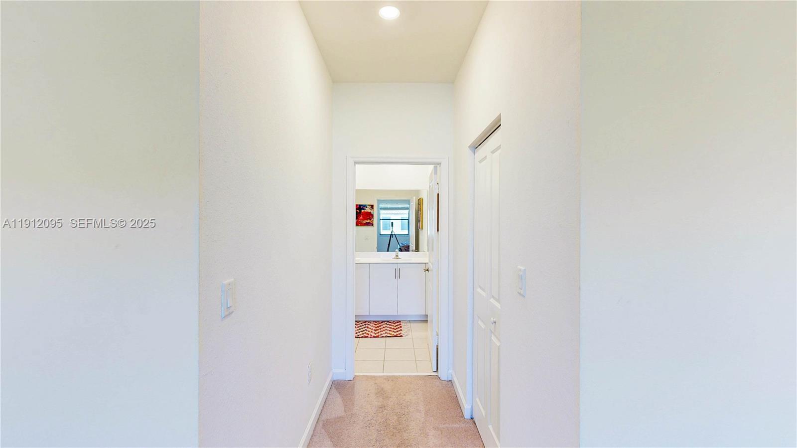 11964 Southwest 244th Street Homestead, FL 33032 - Photo 34 of 62 a view of a hallway with wooden floor and closet