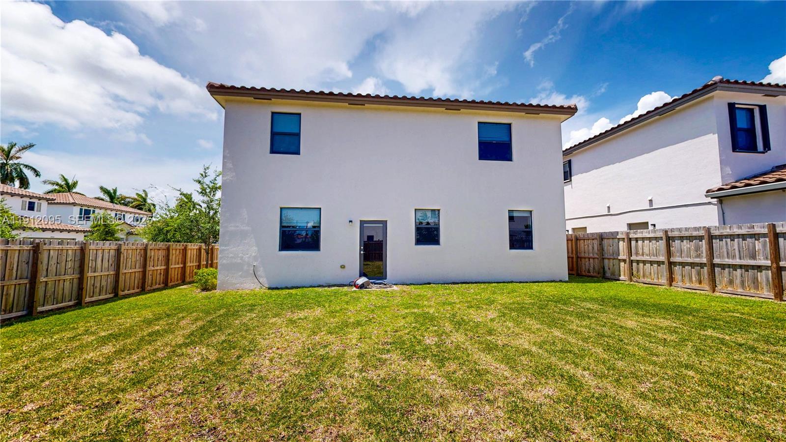 11964 Southwest 244th Street Homestead, FL 33032 - Photo 39 of 62 a view of a house with a yard