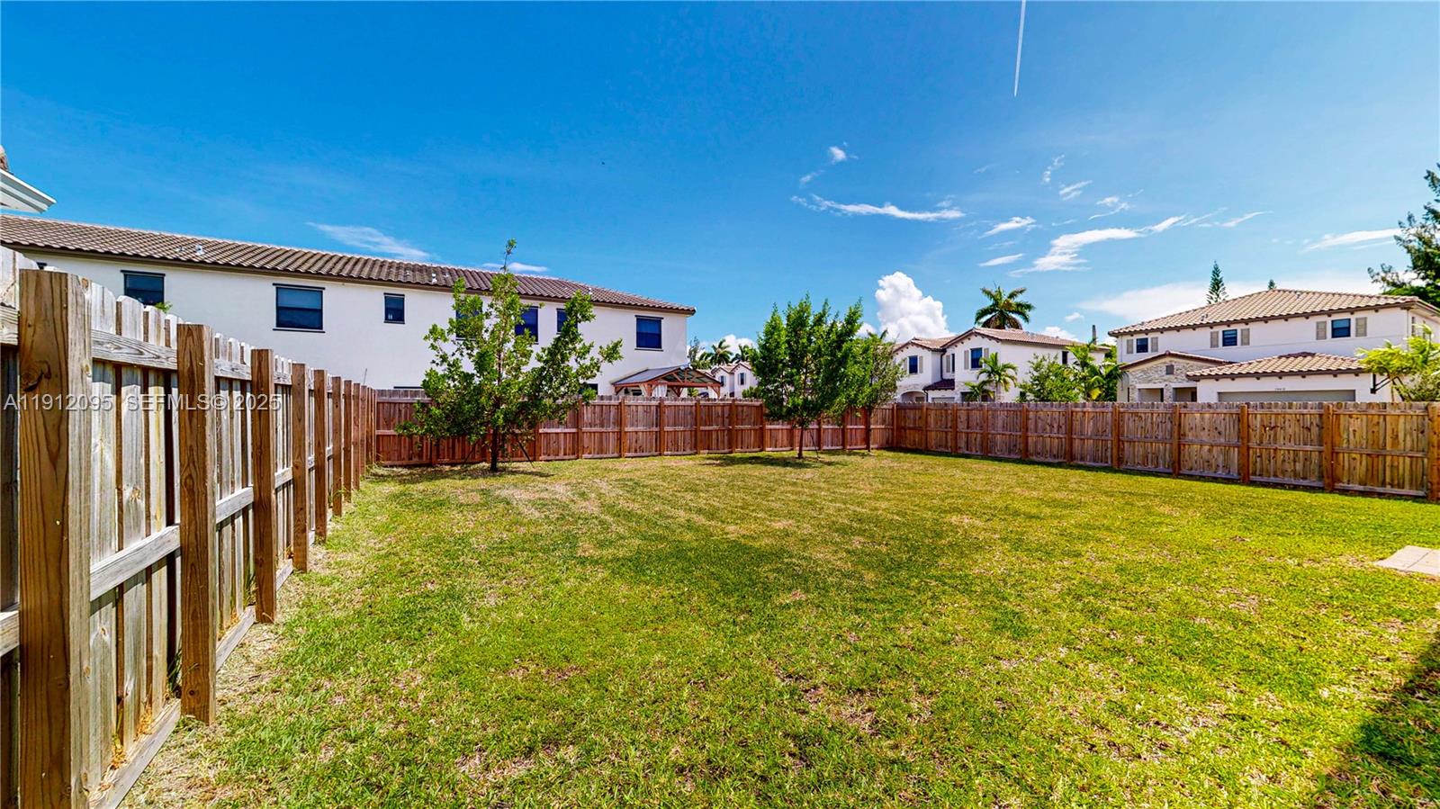 11964 Southwest 244th Street Homestead, FL 33032 - Photo 43 of 62 a view of an house with backyard and patio