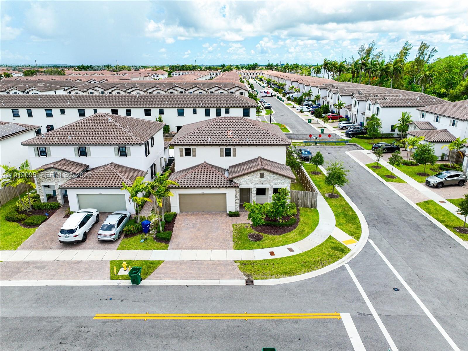 11964 Southwest 244th Street Homestead, FL 33032 - Photo 48 of 62 an aerial view of a house with a garden and swimming pool