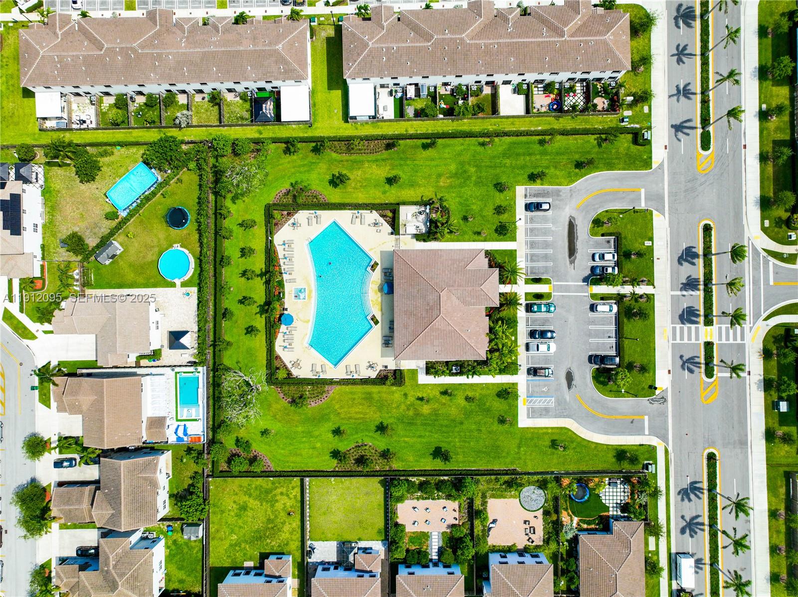 11964 Southwest 244th Street Homestead, FL 33032 - Photo 57 of 62 an aerial view of a house with outdoor space swimming pool patio and lake view