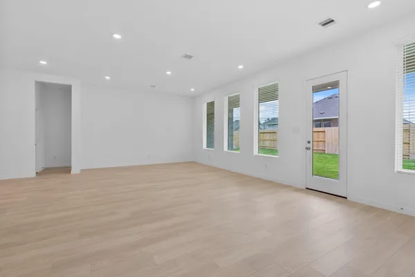 a view of an empty room with a window
