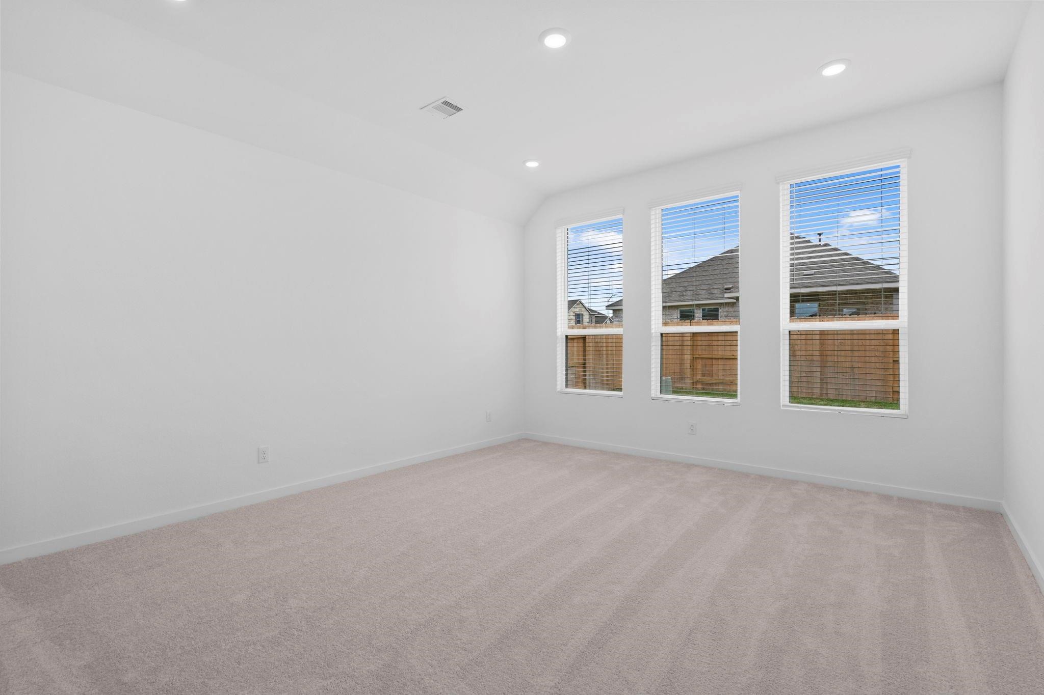 2716 Pine Bluff Drive Rosenberg, TX 77469 - Photo 14 of 32 an empty room with windows