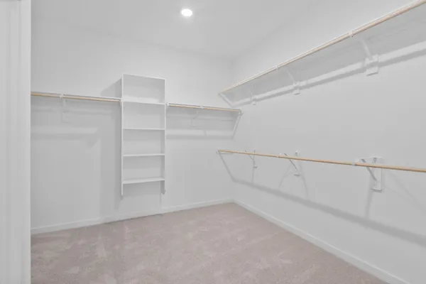 a view of an empty walk in closet