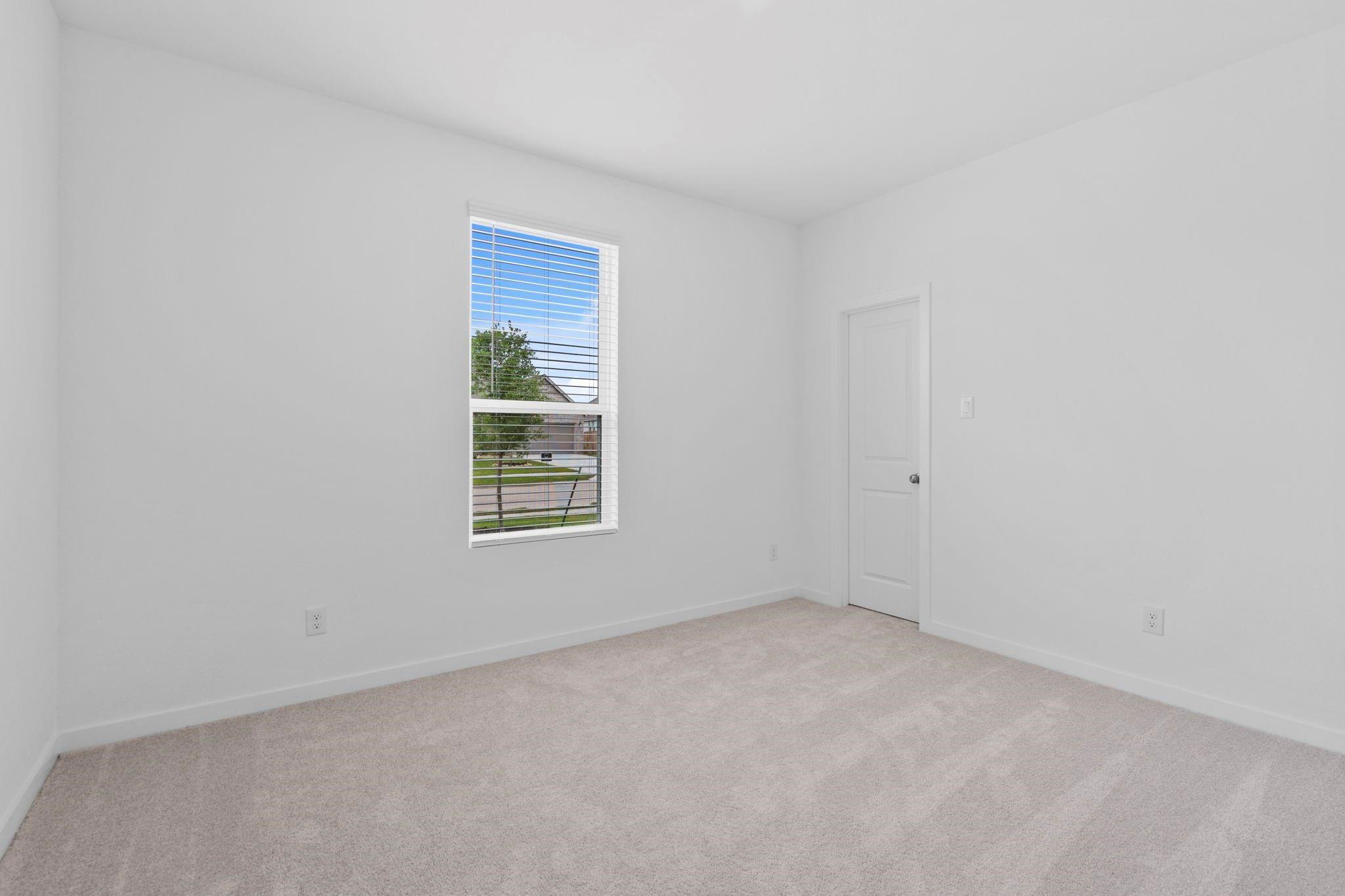 2716 Pine Bluff Drive Rosenberg, TX 77469 - Photo 21 of 32 a view of an empty room with a window