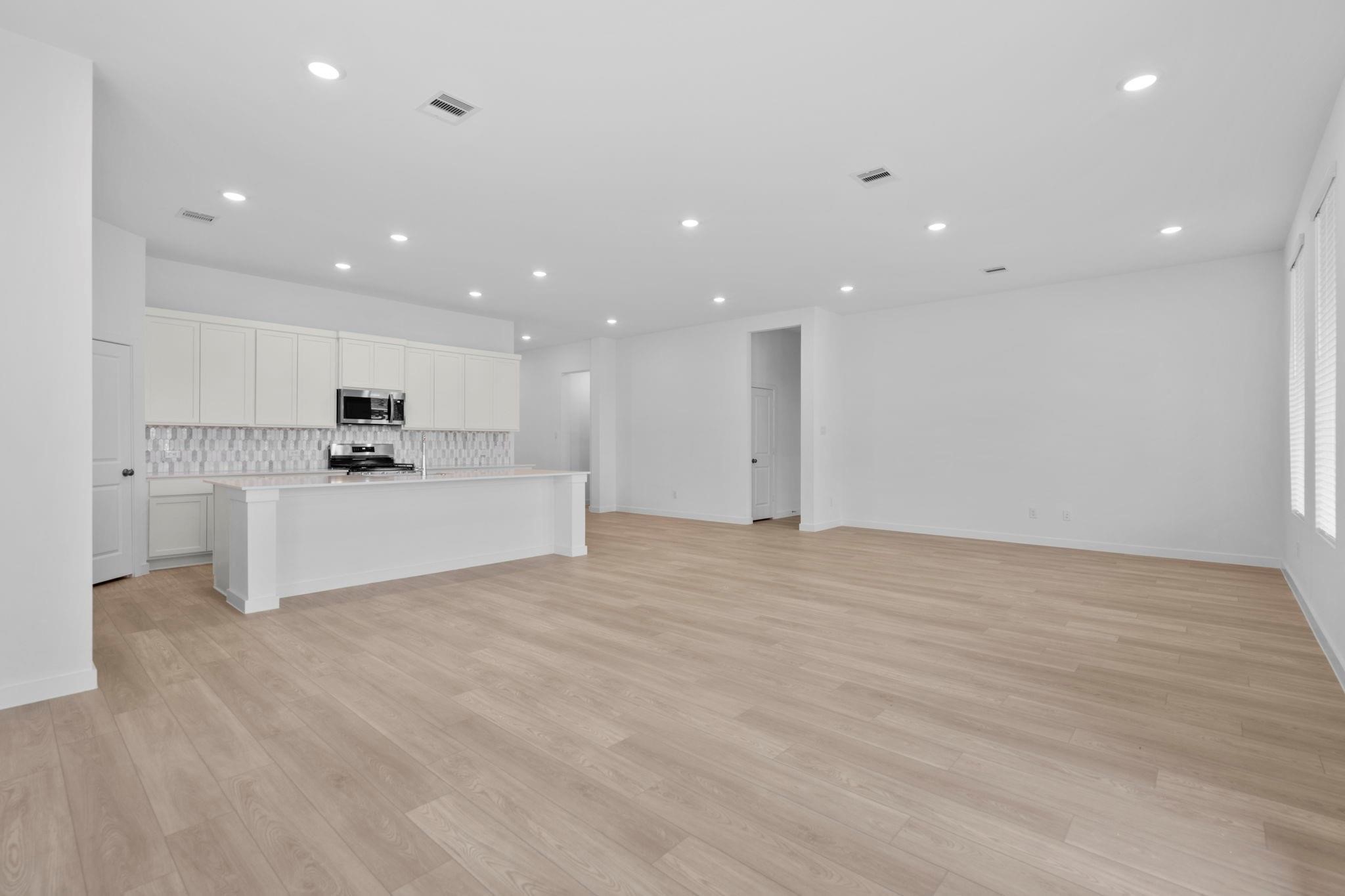 2716 Pine Bluff Drive Rosenberg, TX 77469 - Photo 6 of 32 a view of kitchen with kitchen island a sink and a stove top oven
