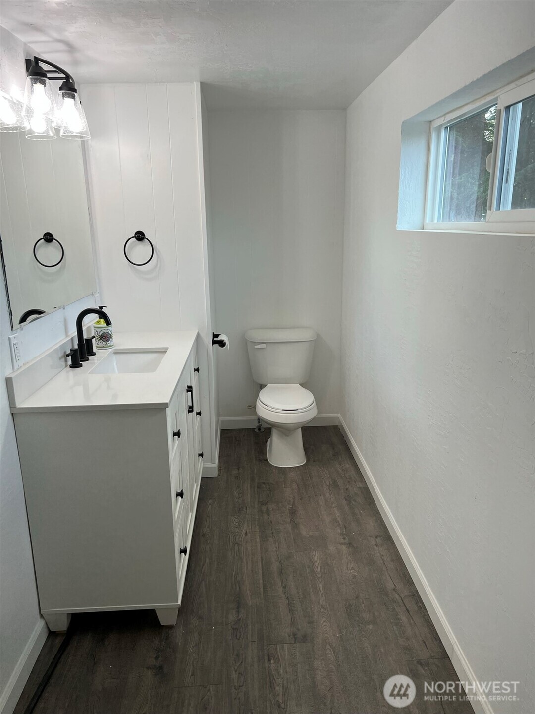 1663 Harrison Avenue Southeast Port Orchard, WA 98366 - Photo 27 of 30 a bathroom with a sink toilet and mirror
