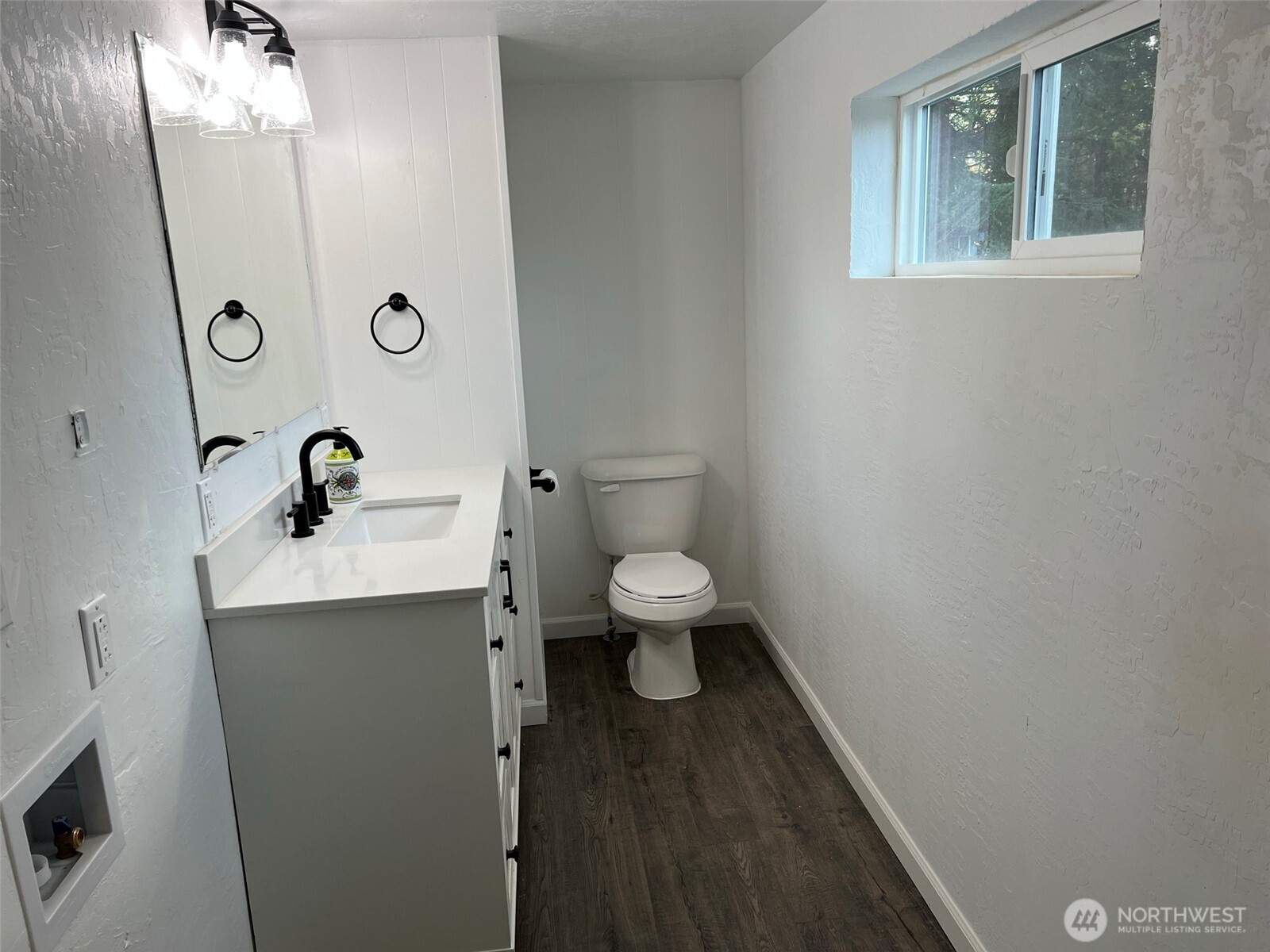 1663 Harrison Avenue Southeast Port Orchard, WA 98366 - Photo 28 of 30 a bathroom with a toilet a sink and mirror