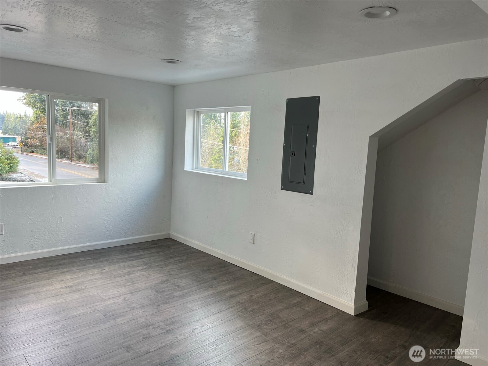 1663 Harrison Avenue Southeast Port Orchard, WA 98366 - Photo 29 of 30 a view of an empty room with wooden floor and a window