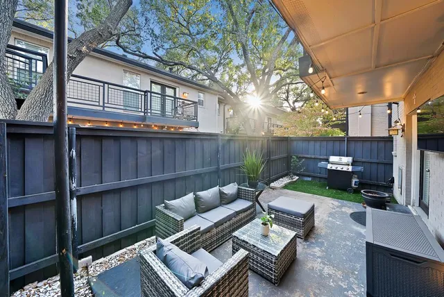 a view of a patio with couches chairs and a fire pit