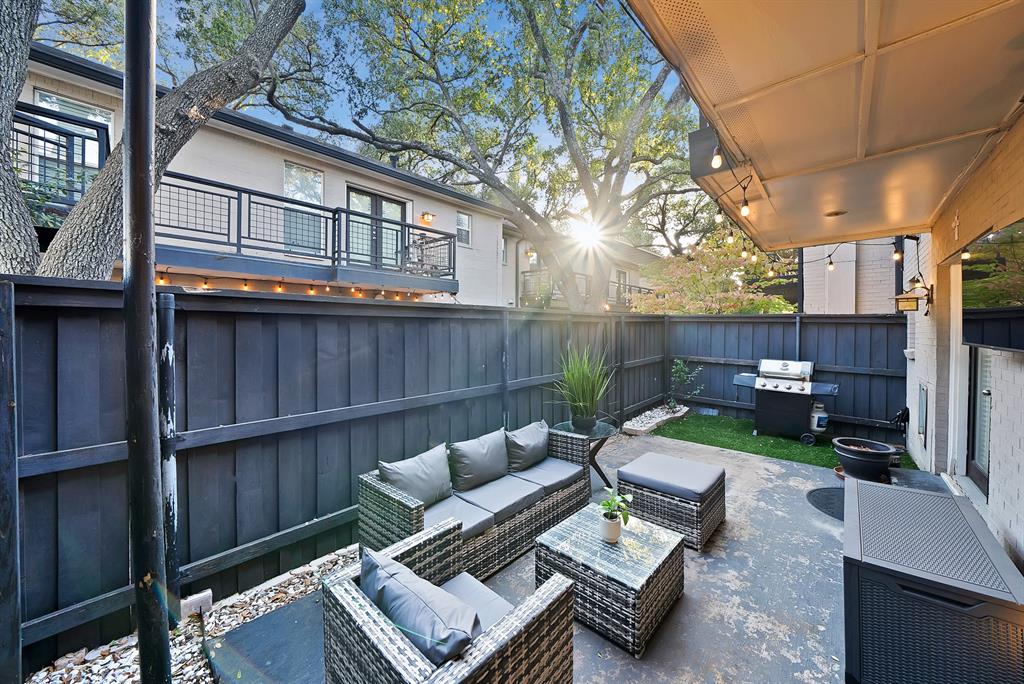 7738 Meadow Road, Unit 109 Dallas, TX 75230 - Photo 2 of 35 a view of a patio with couches chairs and a fire pit