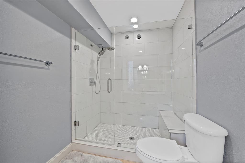 7738 Meadow Road, Unit 109 Dallas, TX 75230 - Photo 23 of 35 a bathroom with a toilet and shower