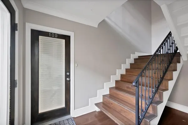 a view of entryway with wooden floor