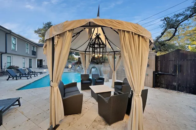a view of a two chairs in the patio