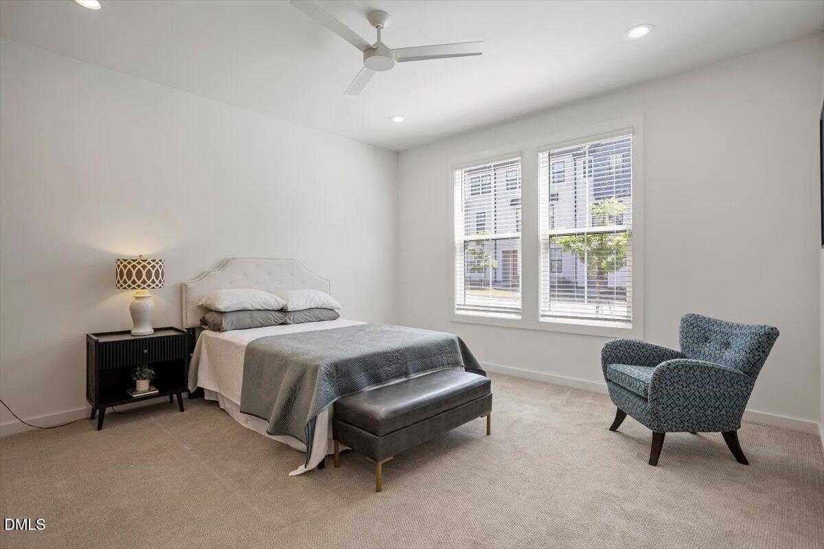 6419 Tanner Oak Lane Raleigh, NC 27613 - Photo 8 of 39 a spacious bedroom with a bed and a couch