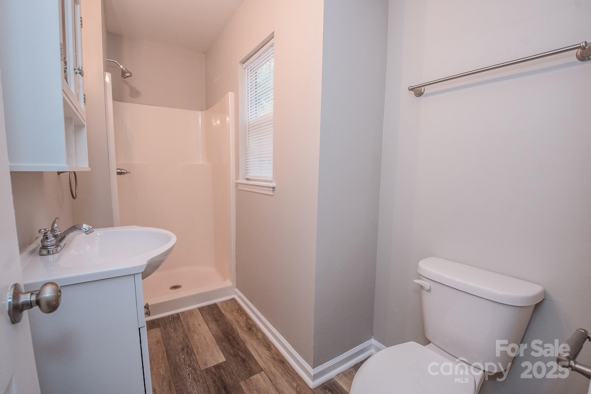 707 Summit Street Monroe, NC 28112 - Photo 15 of 23 a bathroom with a sink toilet and vanity