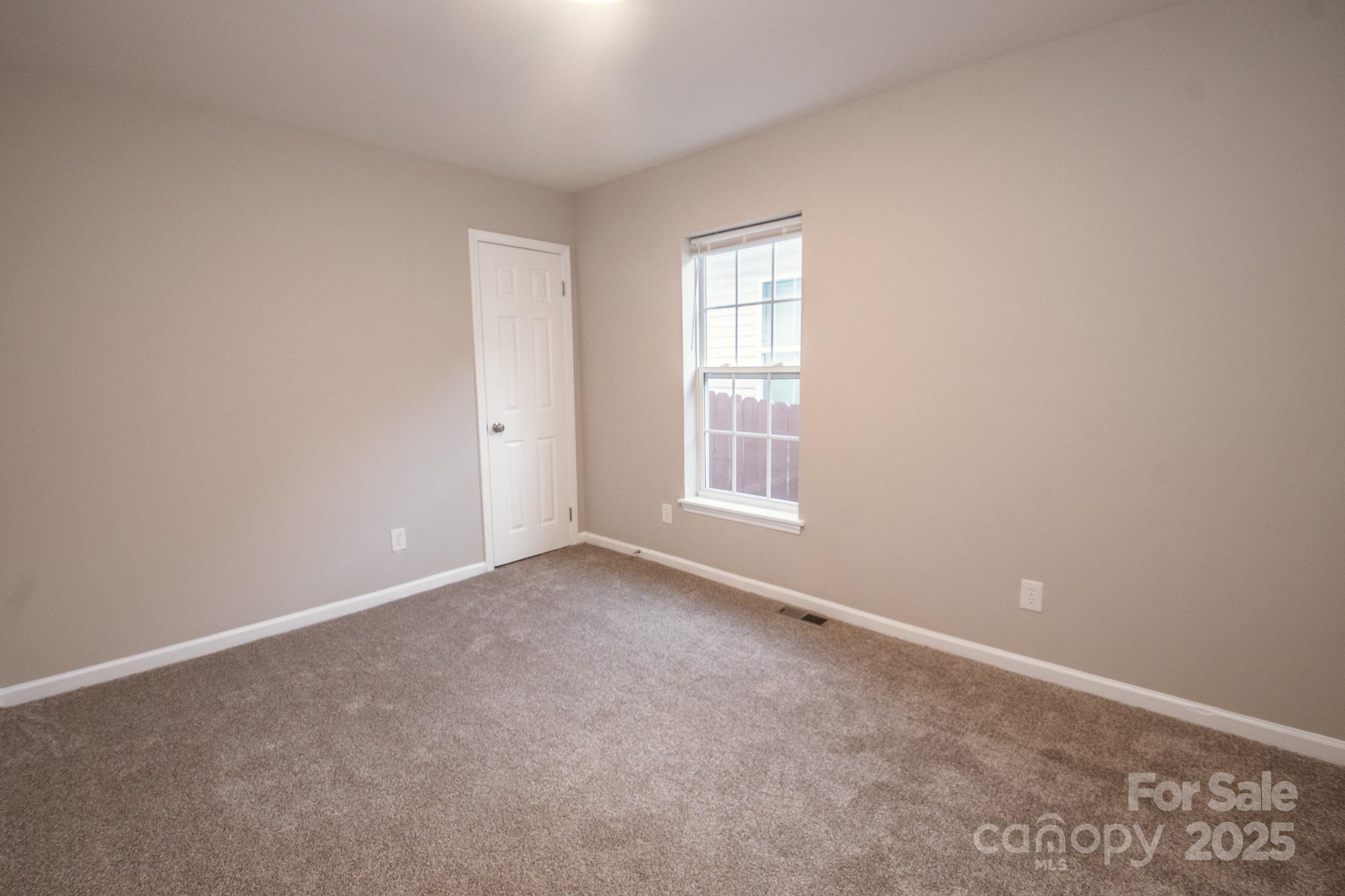 707 Summit Street Monroe, NC 28112 - Photo 16 of 23 an empty room with windows