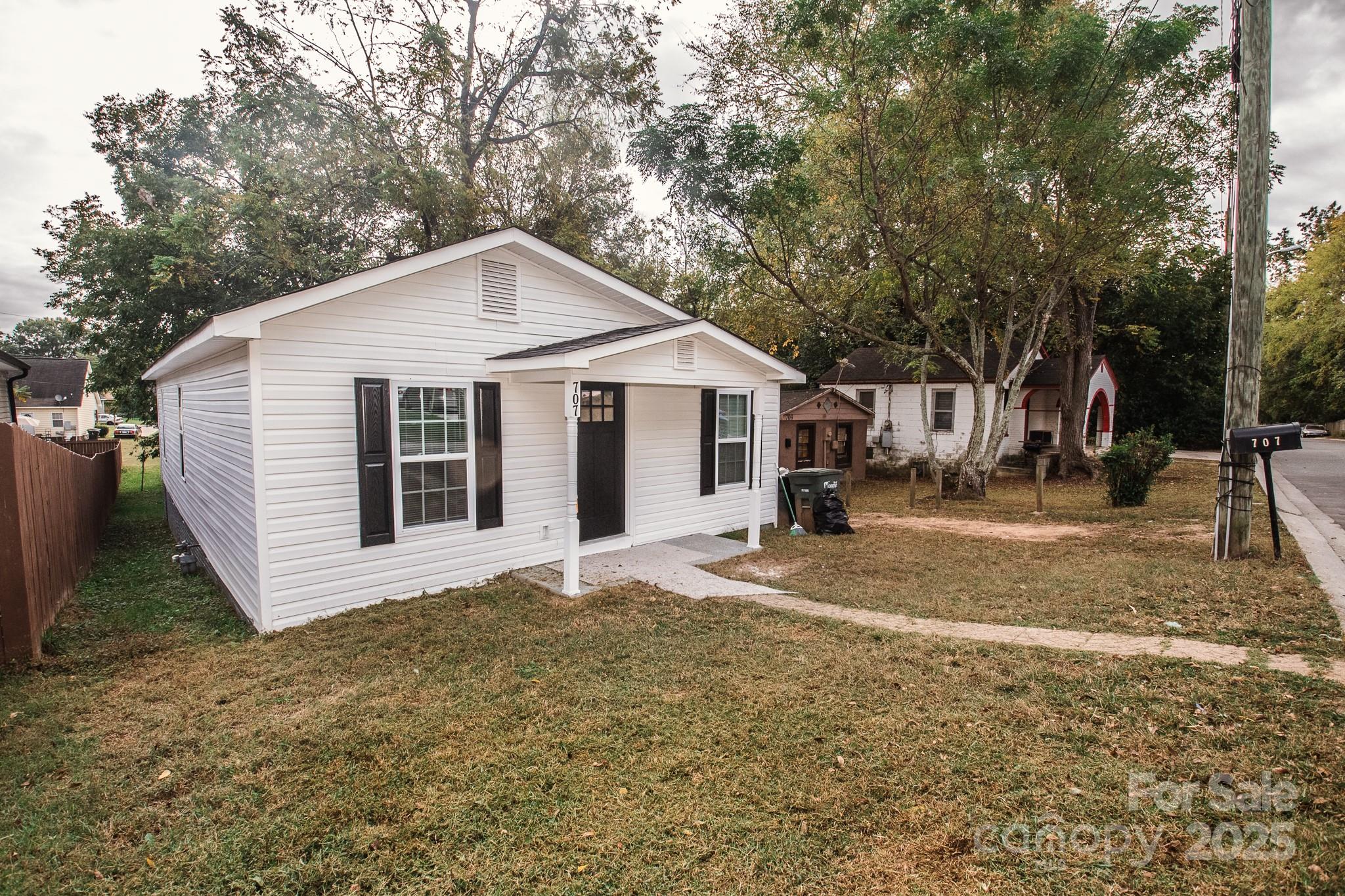 707 Summit Street Monroe, NC 28112 - Photo 3 of 23 a view of a house with a yard