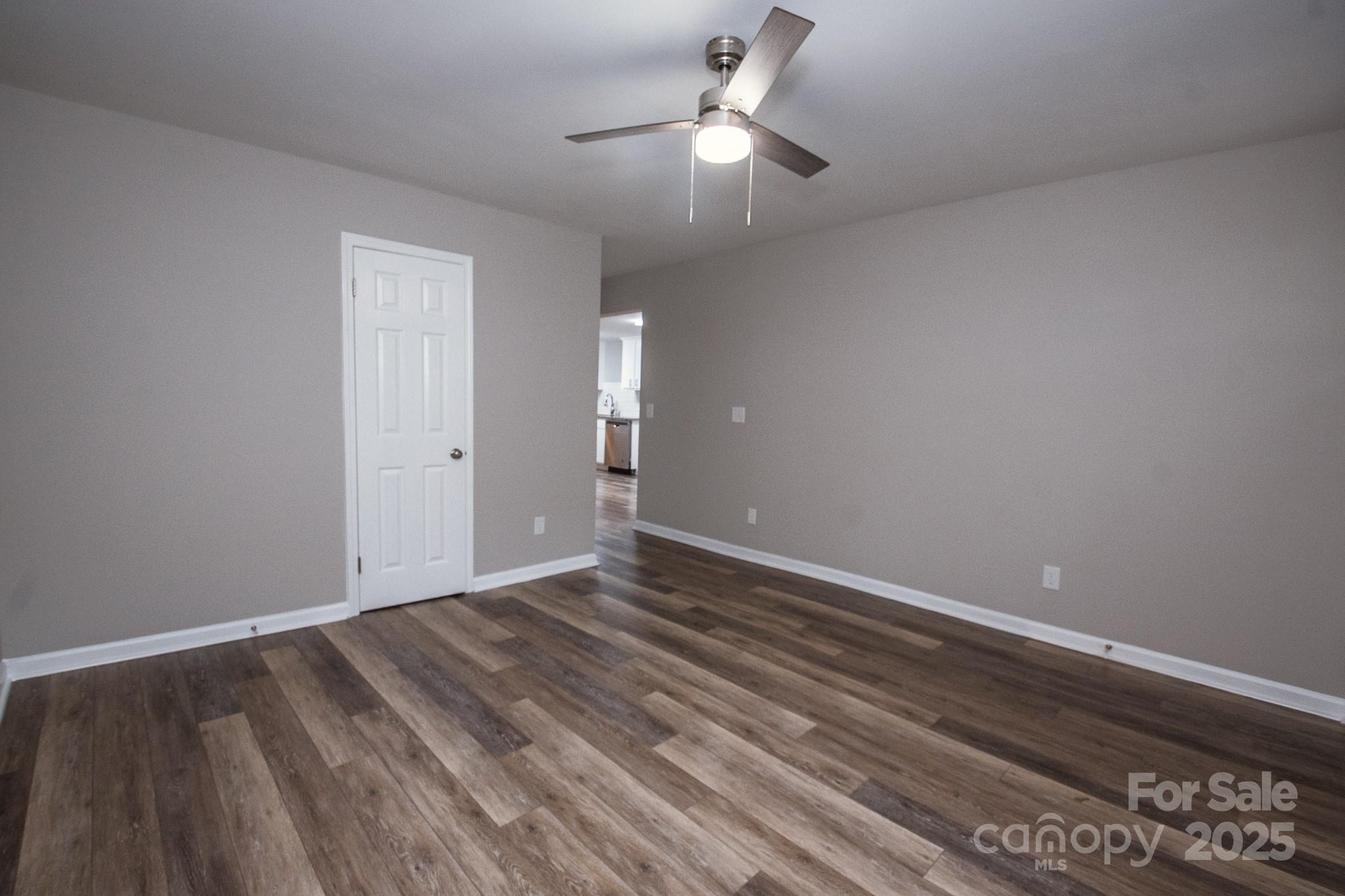 707 Summit Street Monroe, NC 28112 - Photo 5 of 23 a view of an empty room with wooden floor