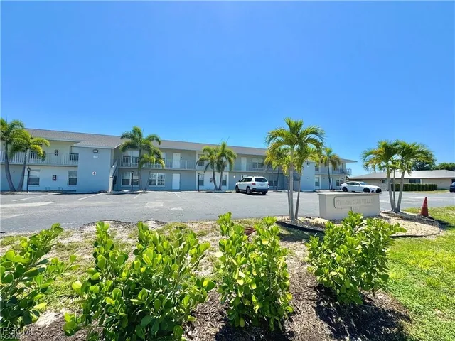 a view of a swimming pool with an outdoor seating area