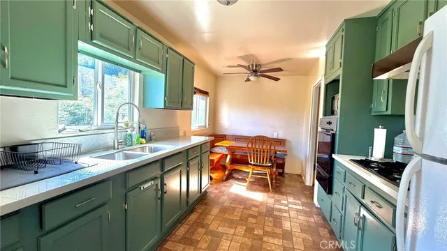 a kitchen with a sink and wooden cabinets