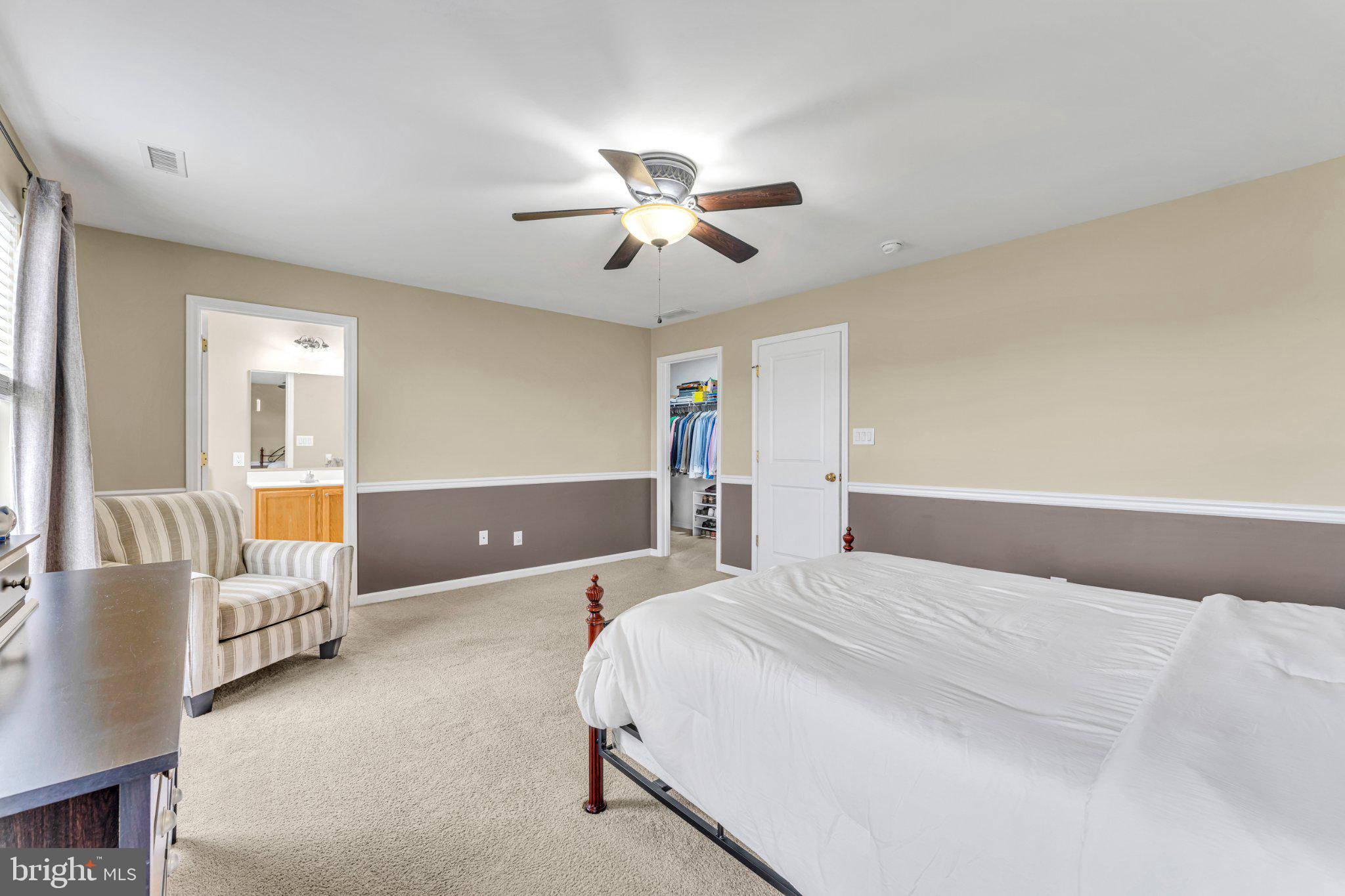 1702 Exposition Drive Williamstown, NJ 08094 - Photo 12 of 34 a bedroom with a bed and a chandelier