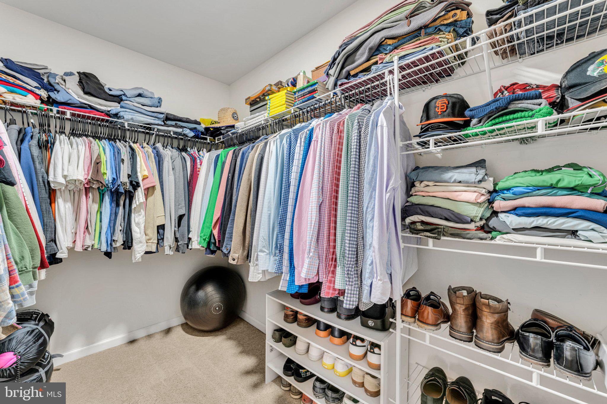 1702 Exposition Drive Williamstown, NJ 08094 - Photo 14 of 34 a view of walk in closet with clothes and shoes