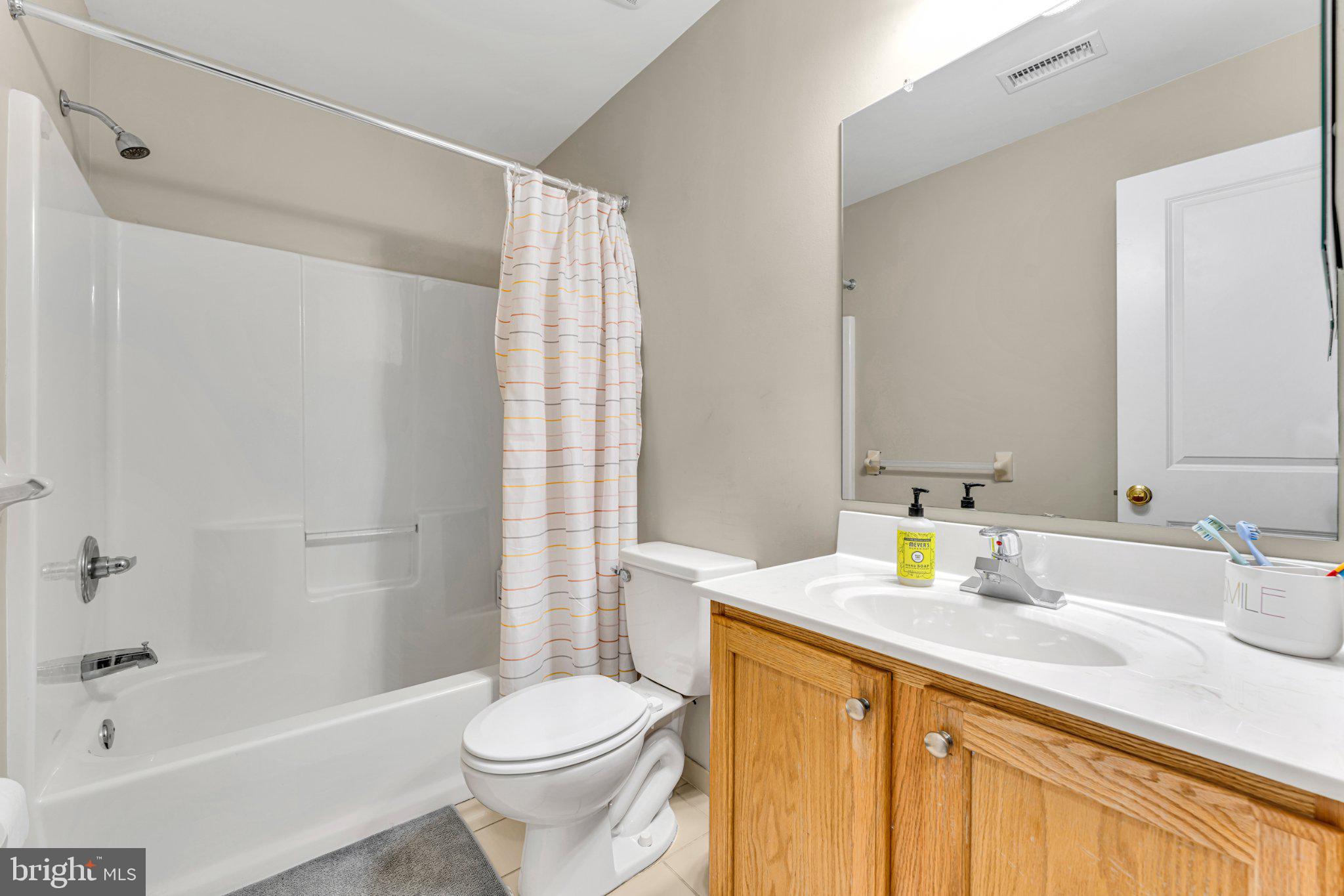 1702 Exposition Drive Williamstown, NJ 08094 - Photo 17 of 34 a bathroom with a sink toilet and shower