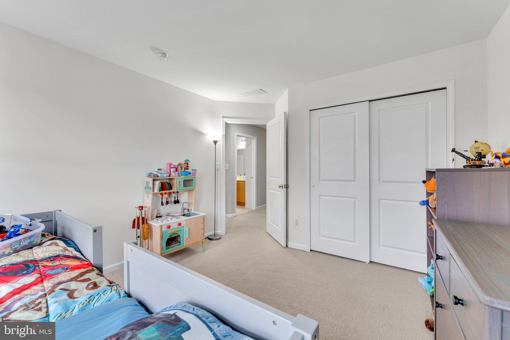 1702 Exposition Drive Williamstown, NJ 08094 - Photo 21 of 34 a playing room with a baby crib furniture and a window