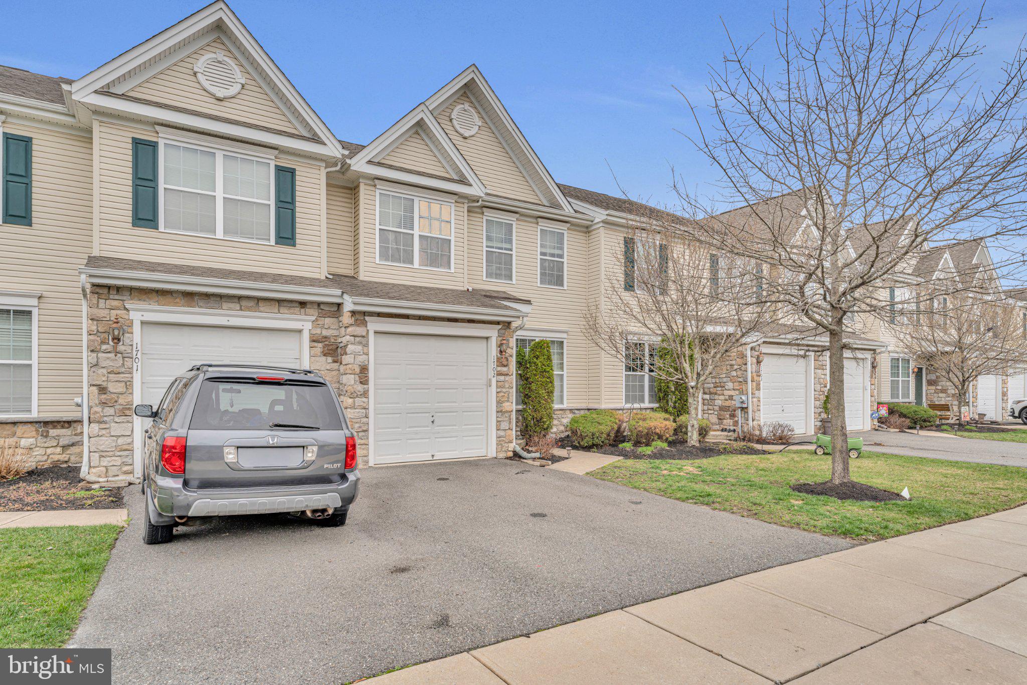 1702 Exposition Drive Williamstown, NJ 08094 - Photo 23 of 34 a view of a car park in front of a house
