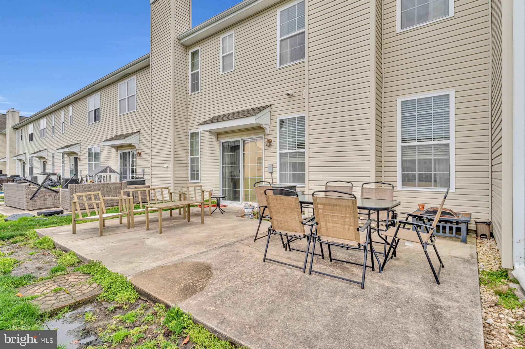 1702 Exposition Drive Williamstown, NJ 08094 - Photo 27 of 34 a view of a patio with couches table and chairs and potted plants