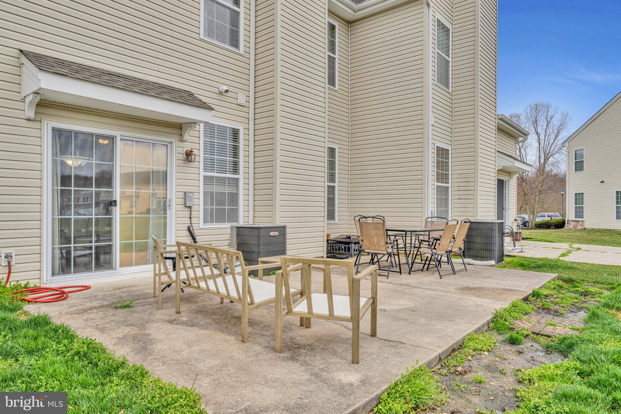1702 Exposition Drive Williamstown, NJ 08094 - Photo 28 of 34 a view of a patio with table and chairs and potted plants