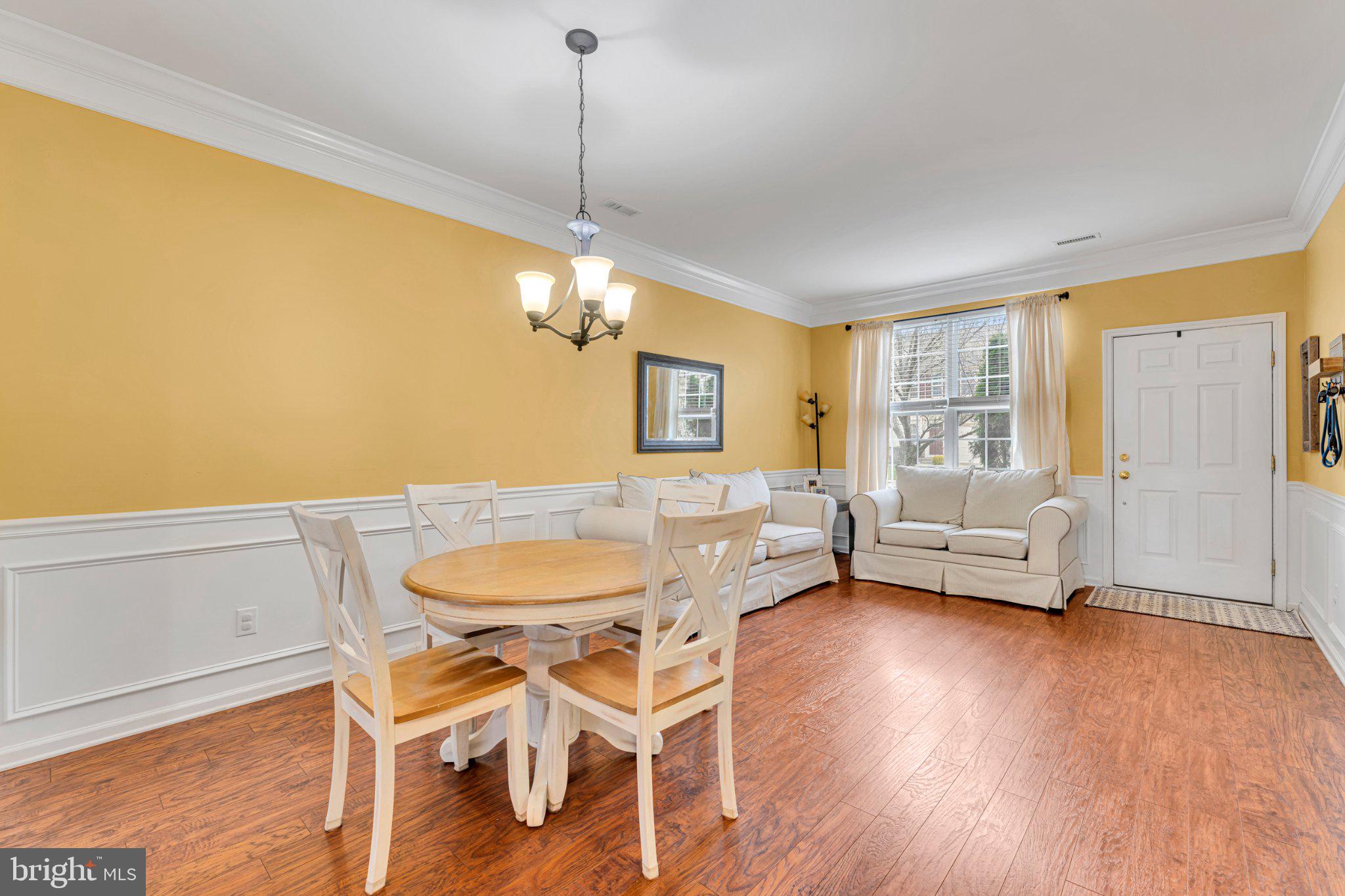 1702 Exposition Drive Williamstown, NJ 08094 - Photo 30 of 34 a living room with furniture and a wooden floor