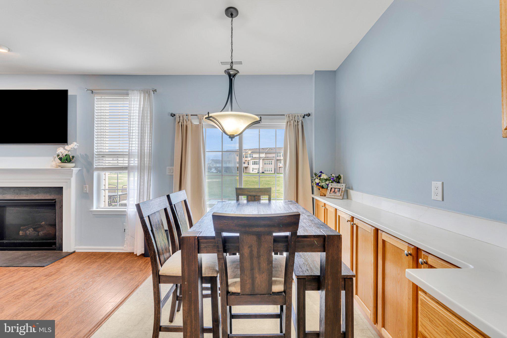 1702 Exposition Drive Williamstown, NJ 08094 - Photo 4 of 34 a view of a dining room with furniture window and wooden floor