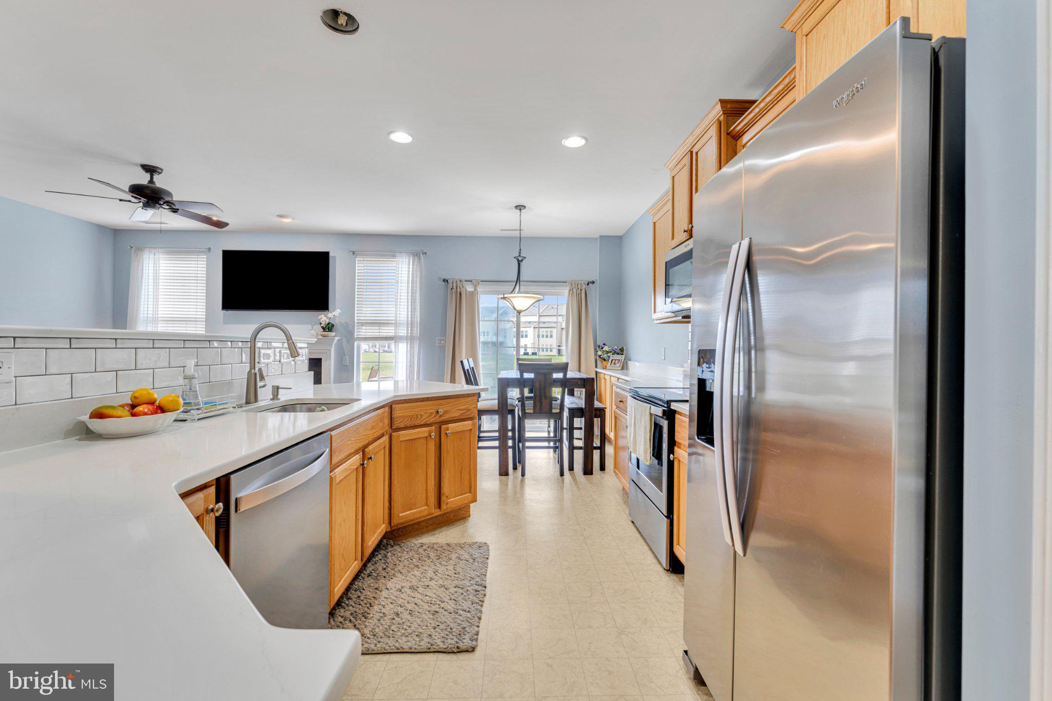 1702 Exposition Drive Williamstown, NJ 08094 - Photo 6 of 34 a kitchen with stainless steel appliances granite countertop a refrigerator and a sink