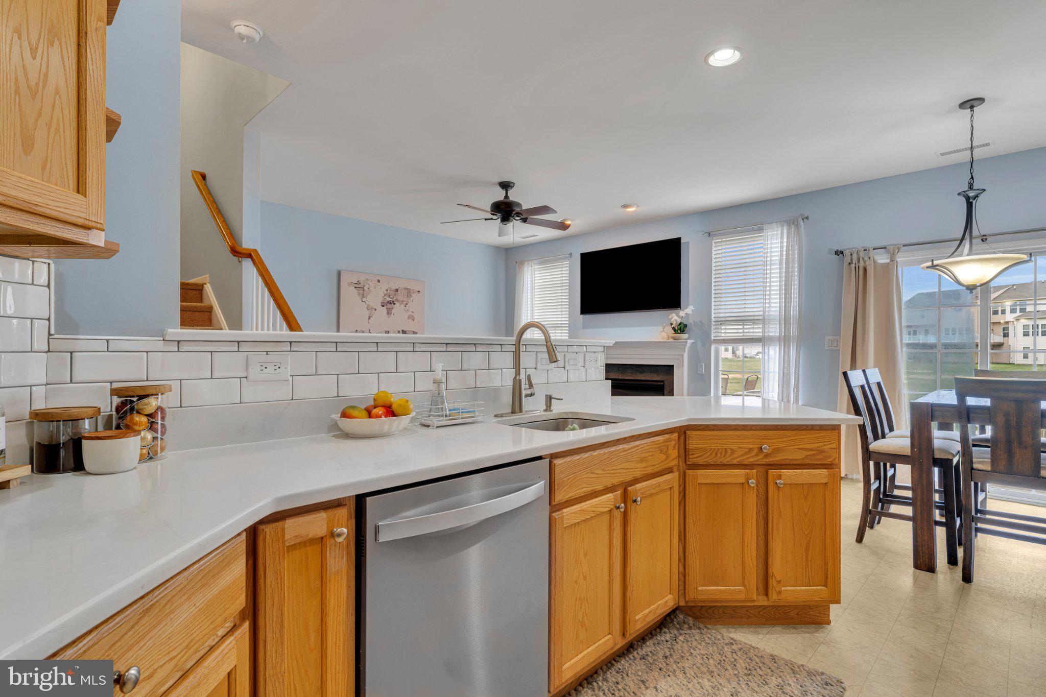 1702 Exposition Drive Williamstown, NJ 08094 - Photo 8 of 34 a kitchen with a sink a microwave and cabinets