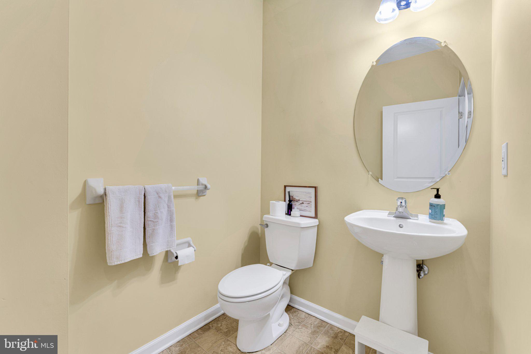 1702 Exposition Drive Williamstown, NJ 08094 - Photo 10 of 34 a bathroom with a sink toilet and a mirror