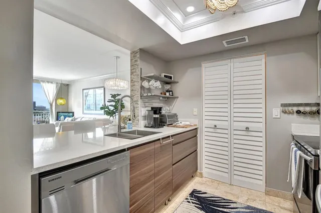 a kitchen with sink cabinets and stove