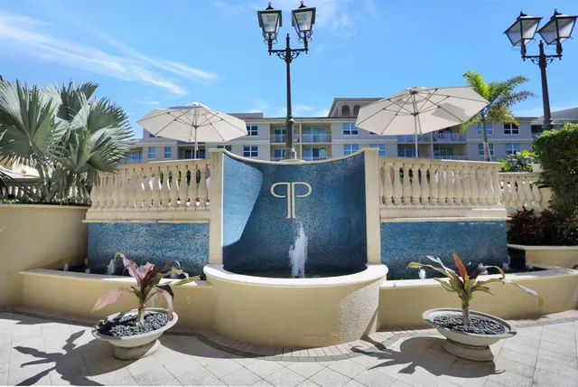 a view of a swimming pool with outdoor seating