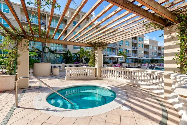 a view of a swimming pool with outdoor seating
