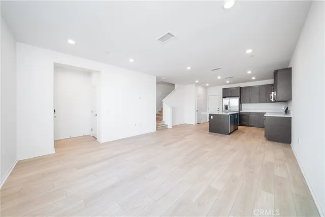a view of kitchen with stainless steel appliances kitchen island