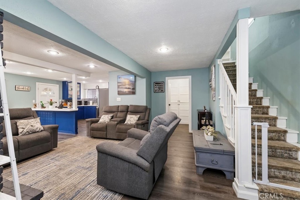 737 Edgar Avenue Beaumont, CA 92223 - Photo 11 of 43 a living room with furniture and wooden floor