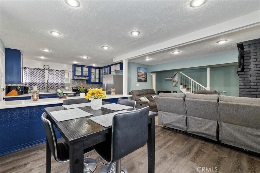 737 Edgar Avenue Beaumont, CA 92223 - Photo 12 of 43 a kitchen with counter and chairs